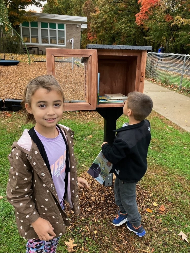 Students outside at ALS Little Free Library