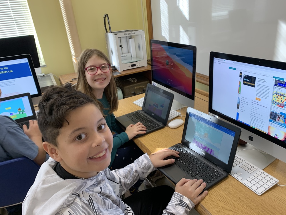 students working on laptops