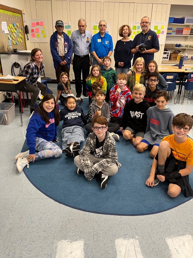 students with Lion's club volunteers