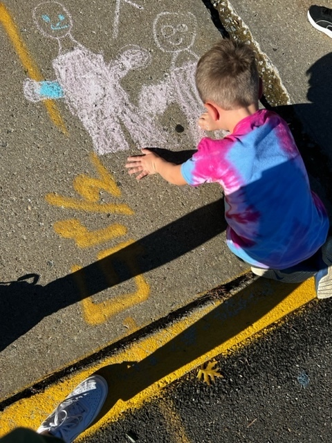 Some of our First graders creating beautiful art for Kindness in Chalk!