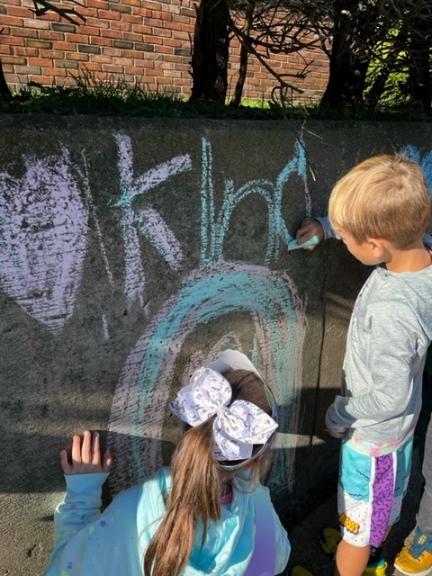 Some of our First graders creating beautiful art for Kindness in Chalk!