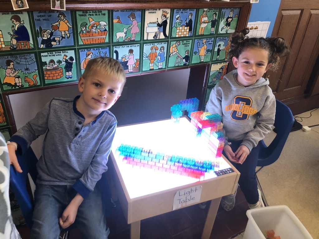 kindergarten students working at the light table 