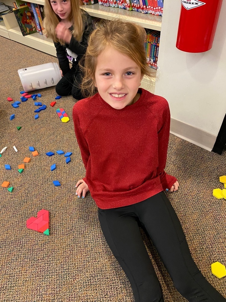 girl made heart with blocks