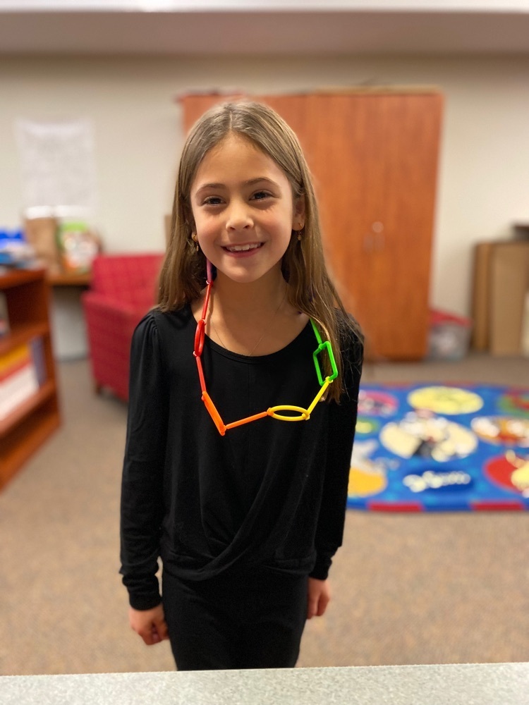 girl made a necklace with suction cups