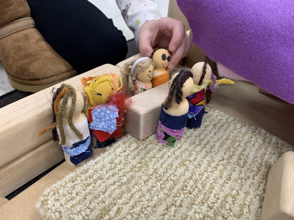 Student-created block people being played with by students